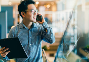 Young and confident asian leader on the phone 1536 x 1067