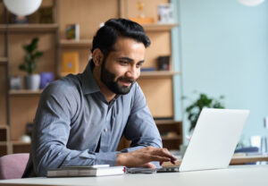 Employee who is smiling while working 1536 x 1067