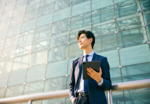 Young businessman holding a tablet 1536 x 1067