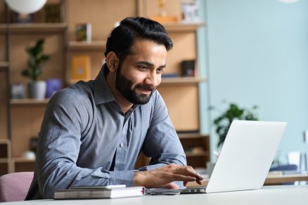 Employee who is smiling while working 1536 x 1067