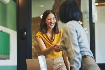 Female-leader-shaking-hands-with-another-person-1536-x-1067