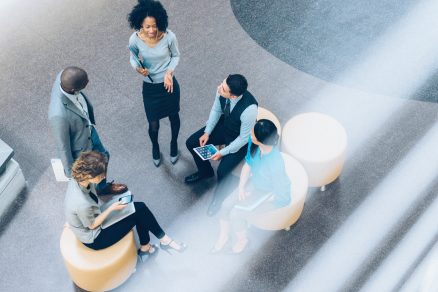 Overhead view of employees meeting outside 1536 x 1067
