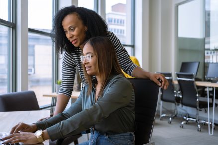 Woman mentoring a young employee