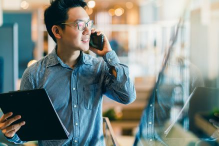 Young and confident asian leader on the phone 1536 x 1067