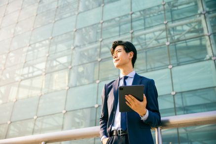 Young businessman holding a tablet 1536 x 1067